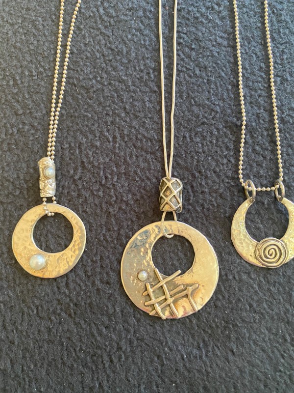 Three Gold Circular Pendants